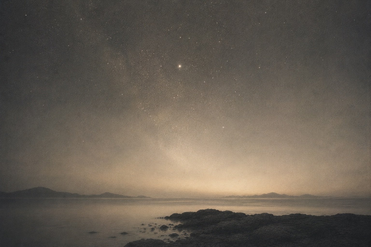 An abstract constellation of soft points of light on a dark ground